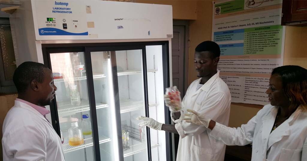 Dr. Boyom's students retrieving samples from a refrigerator from Seeding Labs